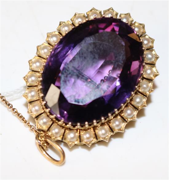An amethyst and pearl brooch